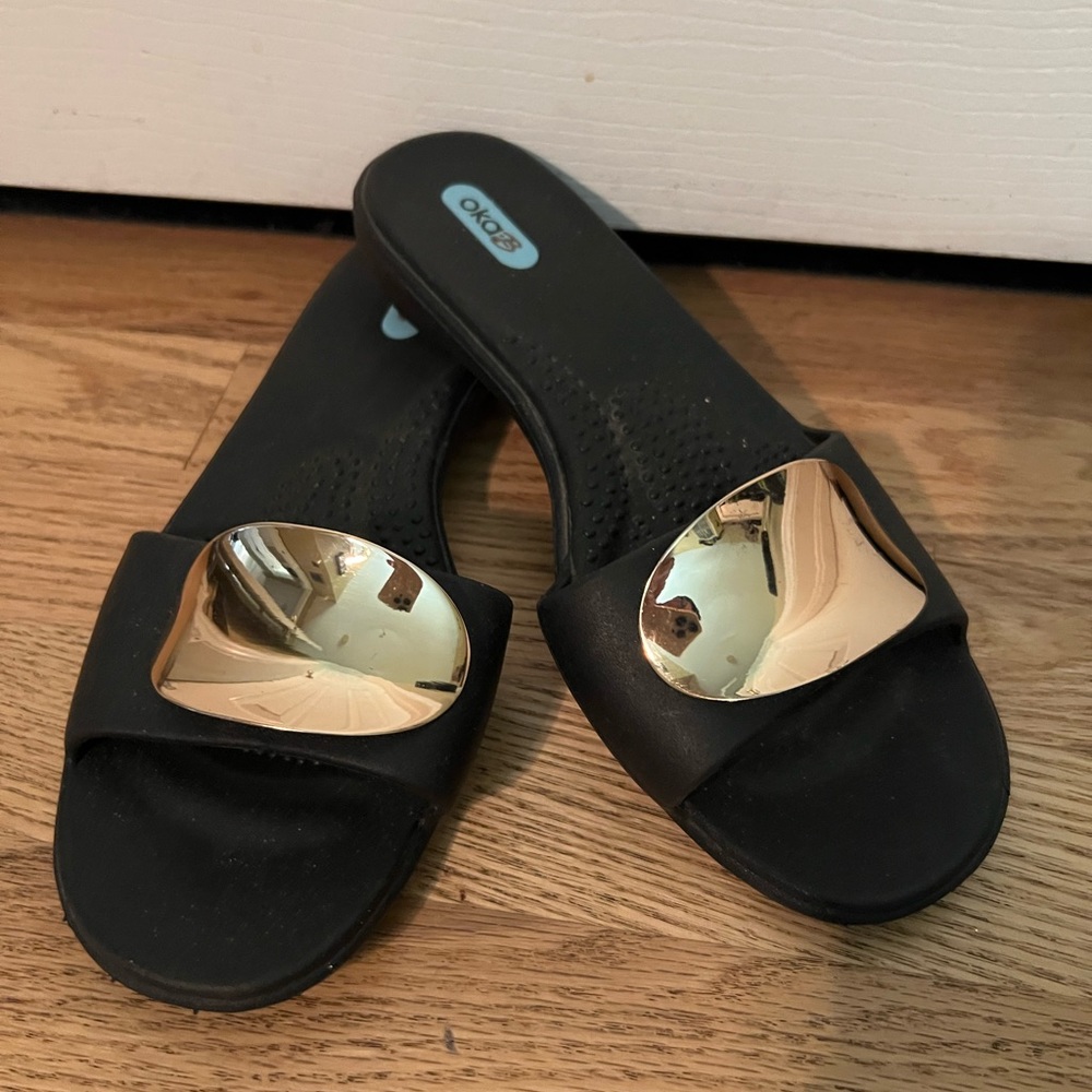 OkaB flip flops with gold accents